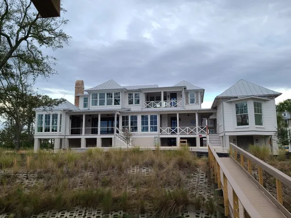 Professional painter showing the transformation of a house